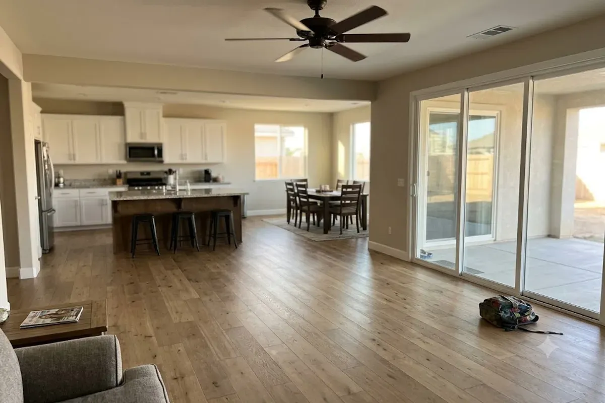 Finished engineered wood floor in an open-plan Bakersfield, CA home